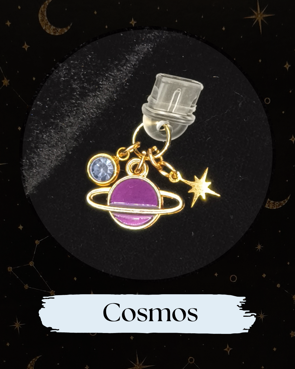 Dust plug for Kindle or e-reader, A gold-tone charm set featuring a purple ringed planet, a gold star, and a small purple gemstone, for Kindle, Kindle Accessory, One More Chapter