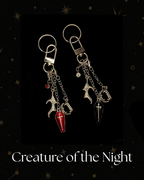 Charmlet for Kindle or e-reader, gothic-themed chain with silver-tone chains and charms, featuring a coffin charm, bat wing and vampire teeth, for Kindle, Kindle Accessory, Kobo, One More Chapter