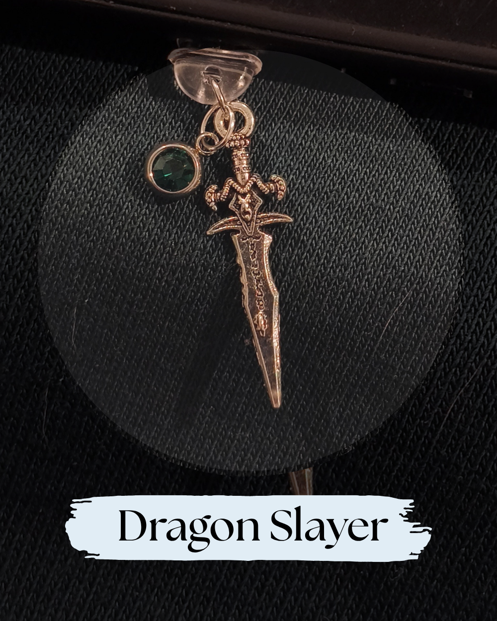 Dust plug for Kindle or e-reader, accessory, a dragon-themed pendant charm featuring a sword and a small green gemstone, for Kindle, Kindle Accessory, One More Chapter