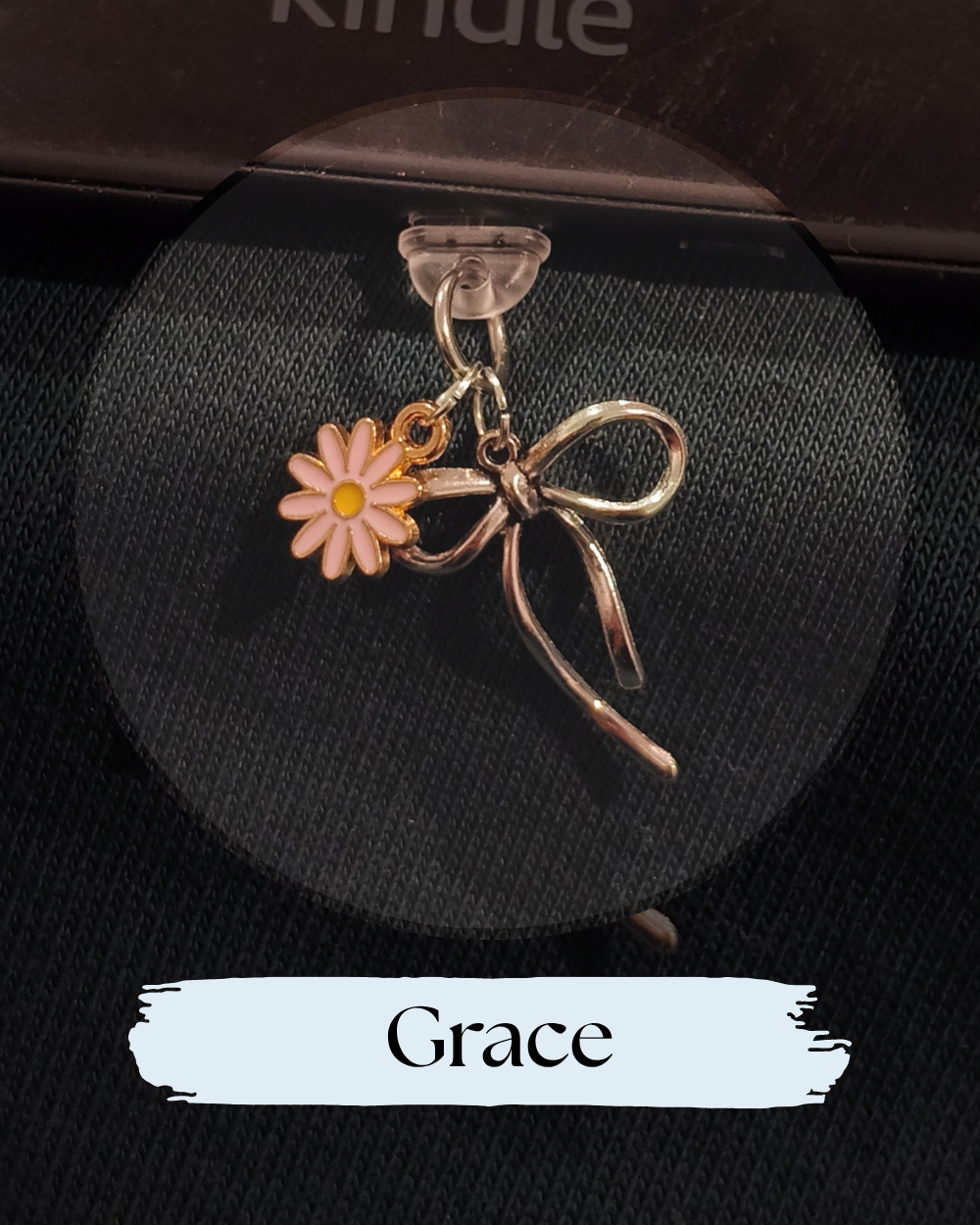 Dust plug for Kindle or e-reader,  charm featuring a pink daisy flower with a yellow center and a metallic silver bow above it, for Kindle, Kindle Accessory, One More Chapter