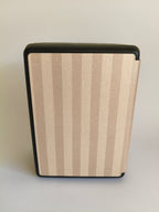 One More Chapter Premium Kindle Case in Barista Blend – closed folio standing upright, warm cream and taupe stripe, back view