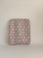 One More Chapter E-reader Sleeve in Petals & Prologues – single padded sleeve back view showing blush pink with scattered white daisy print and cream zip