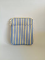 One More Chapter E-reader Sleeve in Rainy Sunday – single padded sleeve front view showing front pocket, periwinkle blue and cream vertical stripe with white zip