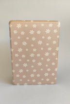 One More Chapter Premium Kindle Case in Petals & Prologues – single closed folio front view, blush pink with scattered white floral print