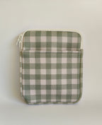 One More Chapter E-reader Sleeve in Booked for Brunch – single padded sleeve front view, sage green and cream gingham with white zip closure