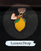 Dust plug for Kindle or e-reader, accessory, a lemon-shaped drop earring charm with a gold-tone outline, yellow enamel body, green leaf accents, and a small  heart charm, for Kindle, Kindle accessory, One More Chapter
