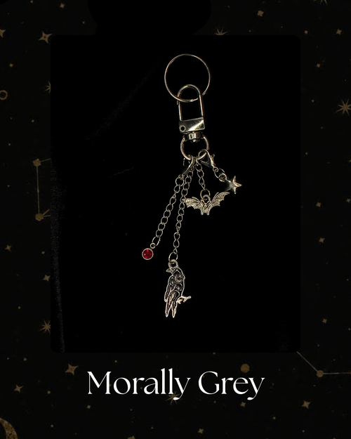 A silver-toned gothic keychain featuring a raven, bat, and star charms, with a small red gem accent, Kindle Accessory, for Kindle, Kobo, One More Chapter