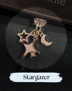 Dust plug for Kindle, e-reader, silver with three celestial shapes: a large star, a smaller outlined star, and a crescent moon, Kindle Accessory, for Kindle, Kobo, One More Chapter
